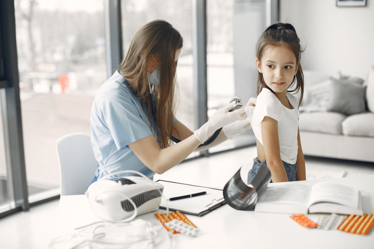 Doctor examining a child